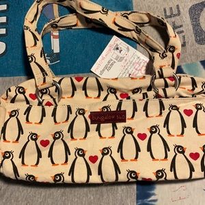 Brand new never used or worn penguin purse